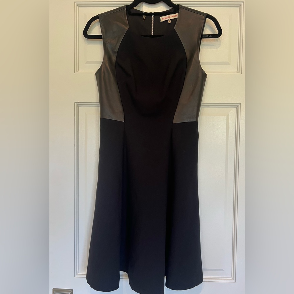 Flattering little black dress with leather insets.